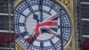 U.K. - The British union flag is seen fluttering as the clock face of Big Ben shows eleven o'clock, London, January 30, 2020