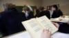 latvia -- A Russian-speaking student reads from a textbook during a Russian literature lesson in a school in Riga February 15, 2012