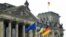 GERMANY – The EU, Ukraine and Germany's flags wave outside the Reichstag building, on the day Ukraine's President Volodymyr Zelenskiy addresses the lower house of parliament, the Bundestag, via videolink, after Russia's invasion of Ukraine, in Berlin, Mar