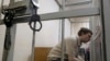 Михаил Косенко во время заседания суда по избранию меры пресечения в рамках "Болотного дела", май 2013 года. Впоследствии Михаил был приговорен к принудительному психиатрическому лечению. Фото: Reuters