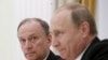 Russia -- Russian Security Council Secretary Nikolai Patrushev (L) looks at President Vladimir Putin during a meeting with the BRICS countries' senior officials in charge of security matters at the Kremlin in Moscow, Russia, May 26, 2015