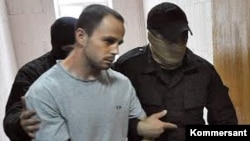 Вячеслав Исаев при задержании, фото "Коммерсантъ"