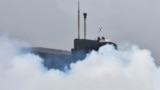 RUSSIA -- SEVEROMORSK, RUSSIA – AUGUST 11, 2016: A a radiological, chemical and biological defence unit takes part in a military drill to create smoke screens to conceal Russian Northern Fleet submarines.