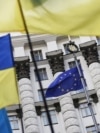 Ukraine -- Ukrainian national flags, flags of Ukrainian trade unions and EU flag are seen during a mass rally in front of the Ukrainian cabinet of ministers building in Kyiv, October 15, 2014