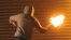 U.K. --A masked nationalist throws a Molotov cocktail at the police on July 14, 2010 during the third night of Nationalist rioting in Belfast.