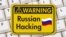 Generic – Warning sign with text Russian hacking on a keyboard. Russia hacking concept