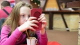 ©Shutterstock - children, kids, mobile, phone, internet