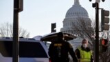Washington, U.S. - Police enforcements arrive to guard the U.S. Capitol, a day after supporters of U.S. President Donald Trump occupied the U.S. Capitol Building