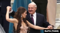  Miss Belarus 2018 Maryya Vasilevich and then Belarusian President Alyaksandr Lukashenka dance at a youth ball in Minsk, Belarus on December 28, 2018.