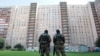 Russia -- Russian Special forces soldiers block an area as they raid an apartment building in St. Petersburg in an operation targeting North Caucasus militants, reportedly killing two suspects, August 17, 2016