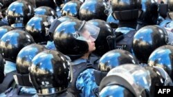 The Russian National Guard during an unauthorized July 27 rally in Moscow for independent and opposition candidates be allowed to run for office in a local election in September,.