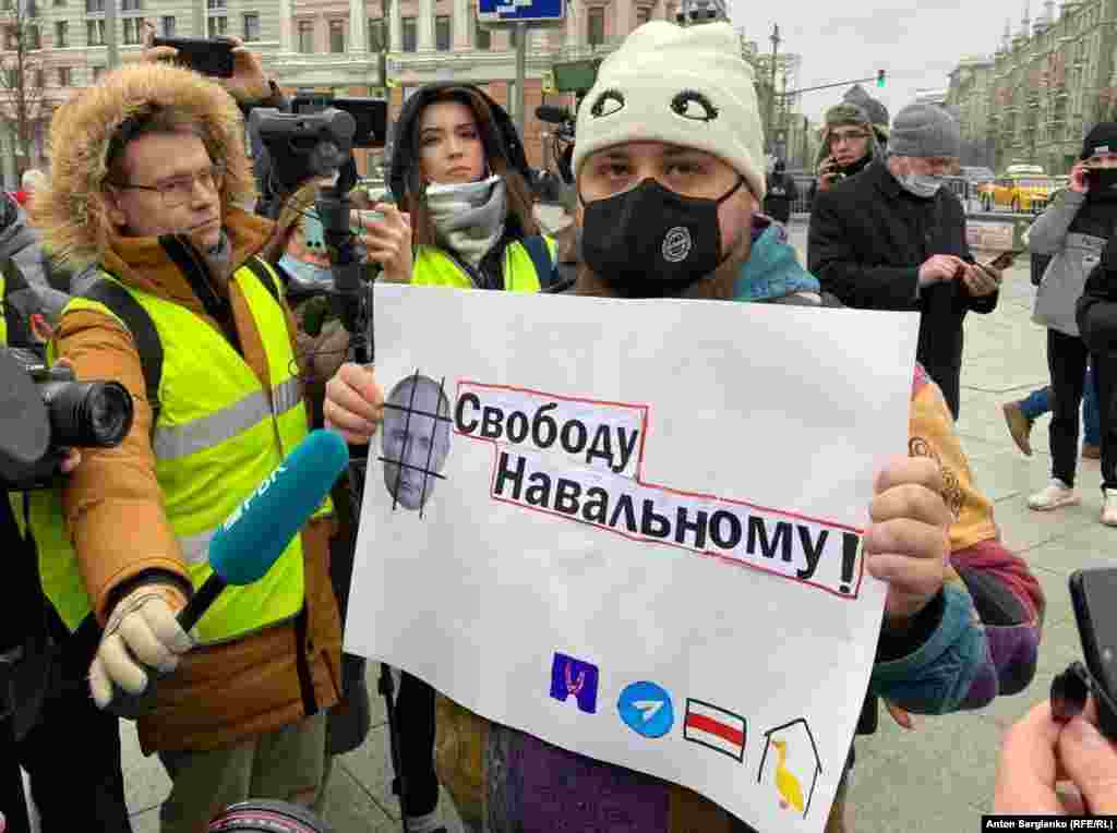 This man, later seen detained, appeared to be one of the first to display a poster (declaring &quot;Freedom for Navalny&quot;) on Moscow&#39;s Pushkin Square.&nbsp;