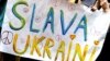 ARGENTINA – A demonstrator holds a sign that reads "Glory to Ukraine" while protesting Russia's massive military operation against Ukraine, in Buenos Aires, Argentina, February 25, 2022