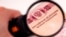 GENERIC – Observing Russain foreign passsport through a magnifying glass