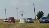 UKRAINE -- Local cars drive past the memorial to victims of the MH17 disaster, near the pro-Russian rebels controlled village of Hrabove, Donetsk region, July 17, 2019