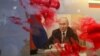 Портрет президента России Владимира Путина во время антивоенной акции у российского посольства в Румынии размазали красной краской, Бухарест, 26 февраля 2022 года