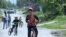 Kyrgyzstan -- boys riding a bicycle in a village close to Bishkek on May 20, 2018