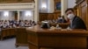 Kiev, Ukraine - Ukrainian President Volodymyr Zelenskiy, wearing a protective mask used as a preventive measure against coronavirus disease (COVID-19), attends an emergency session of parliament