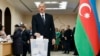 Azerbaijani President Ilham Aliyev casts his ballot at a Baku polling station during Azerbaijan's February 9, 2020 parliamentary elections.