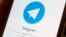The Telegram logo is seen on a screen of a smartphone - generic