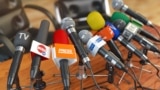 GENERIC – Press conference or interview concept. Microphones of different mass media, radio, tv and press prepared for conference meeting. 3d illustration.