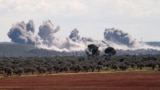 SYRIA -- Smoke billows over the village of Qaminas, about 6 kilometres southeast of Idlib city in northwestern Syria, following reported Russian air strikes in northwestern Syria, March 1, 2020