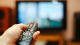 Generic -- Watching TV and using remote controller