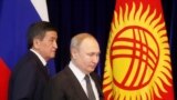 Bishkek, Kyrgyzstan - Russian President Vladimir Putin (R) and his Kyrgyz counterpart Sooronbay Jeenbekov / Russian President Vladimir Putin (R) and his Kyrgyz counterpart Sooronbay Jeenbekov attend a signing ceremony following their talks in Bishkek, Kyr