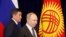 Bishkek, Kyrgyzstan - Russian President Vladimir Putin (R) and his Kyrgyz counterpart Sooronbay Jeenbekov / Russian President Vladimir Putin (R) and his Kyrgyz counterpart Sooronbay Jeenbekov attend a signing ceremony following their talks in Bishkek, Kyr