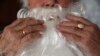 Almaty, Kazakhstan - Dmitry Slektor, 71, a pensioner who worked as a mechanic at a glass factory, poses for a photograph dressed as Santa Claus in his apartment