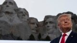 U.S. -- President Donald Trump smiles at Mount Rushmore National Memorial, Friday, July 3, 2020, near Keystone, S.D. 