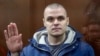 RUSSIA -- Programmer Sergei Surovtsev charged with assaulting law enforcement officers during an unsanctioned protest in the capital on July 27, attends a court hearing in Moscow, December 17, 2019