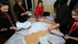 AZERBAIJAN -- Members of a local electoral commission count ballots at a polling station after a snap parliamentary election in Baku, February 9, 2020