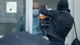 RUSSIA -- A security controls a student with food on an entrance of the quarantined building housing educational premises and a dormitory of St. Petersburg Medical Academy of Postgraduate Education in St. Petersburg, March 5, 2020