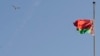 Belarus -- The national flag flies at half-mast marking the death of the late Venezuelan President Hugo Chavez, in Minsk, 06Mar2013