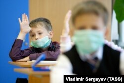 Children attend classes in School #7 in Sakhalin, Russia before self-isolation measures against COVID-19 went into effect.