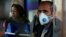 Tehran, Iran - An Iranian man wears a protective masks to prevent contracting coronavirus, as he sits in the bus in Tehran, Iran February 25, 2020.