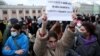 RUSSIA – A demonstrator holds up a sign reading "today they kill Navalny, tomorrow they kill me" during a rally in support of jailed Russian opposition politician Alexei Navalny in Moscow, April 21, 2021