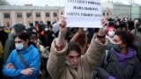 RUSSIA – A demonstrator holds up a sign reading "today they kill Navalny, tomorrow they kill me" during a rally in support of jailed Russian opposition politician Alexei Navalny in Moscow, April 21, 2021