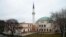 Austria -- A woman passes the Islamic Centre mosque in Vienna, February 26, 2015
