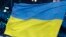 SOUTH KOREA -- Olena Pidhrushna carries the flag of Ukraine during the opening ceremony of the 2018 Winter Olympics in Pyeongchang, South Korea, Friday, Feb. 9, 2018