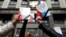 Russia -- Participants hold booklets containing the Constitution of the Russian Federation during a protest against a housing resettlement program outside the building of the State Duma, in central Moscow, June 14, 2017