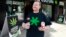 CANADA, -- Authorized marijuana distributor John Berfelo stands outside Marc Emery's Cannabis Cafe as he holds two accredited child resistant packaging containers for recreational cannabis for legalization in Vancouver, British Columbia, June 20, 2018