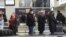 RUSSIA -- Passengers wait for their luggage at Novosibirsk International Airport, April 1, 2020