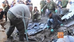 В Донецком аэропорту прошла эксгумация погибших военных