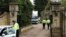 U.K. -- Policemen walk through the gates and up the path past a forensics van outside the house of Russian tycoon Boris Berezovsky in Sunningdale near Ascot in Berkshire, 25Mar2013