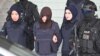 MALAYSIA -- Vietnamese national Doan Thi Huong (C) is escorted by Malaysian police after a hearing at the Shah Alam High Court, outside Kuala Lumpur, March 11, 2019