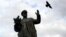 CZECH REPUBLIC -- A bird flies past the monument of Soviet World War II commander Ivan Stepanovic Konev in Prague, September 12, 2019