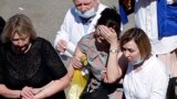 TASTARSTAN -- A woman cries as she is taken to an ambulance at the scene of a shooting at School No. 175 in Kazan, the capital of Russia's republic of Tatarstan, on May 11, 2021. (Photo by Roman Kruchinin / AFP)