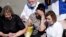 TASTARSTAN -- A woman cries as she is taken to an ambulance at the scene of a shooting at School No. 175 in Kazan, the capital of Russia's republic of Tatarstan, on May 11, 2021. (Photo by Roman Kruchinin / AFP)